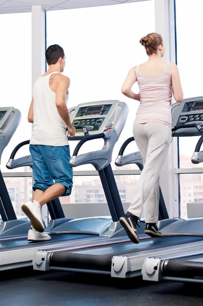 Woman and man at gym exercising. — Stock Photo, Image