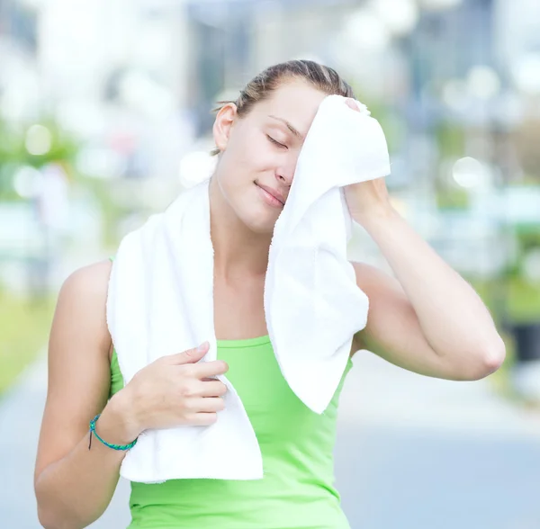 Tired woman after fitness time in city park — Stock Photo, Image