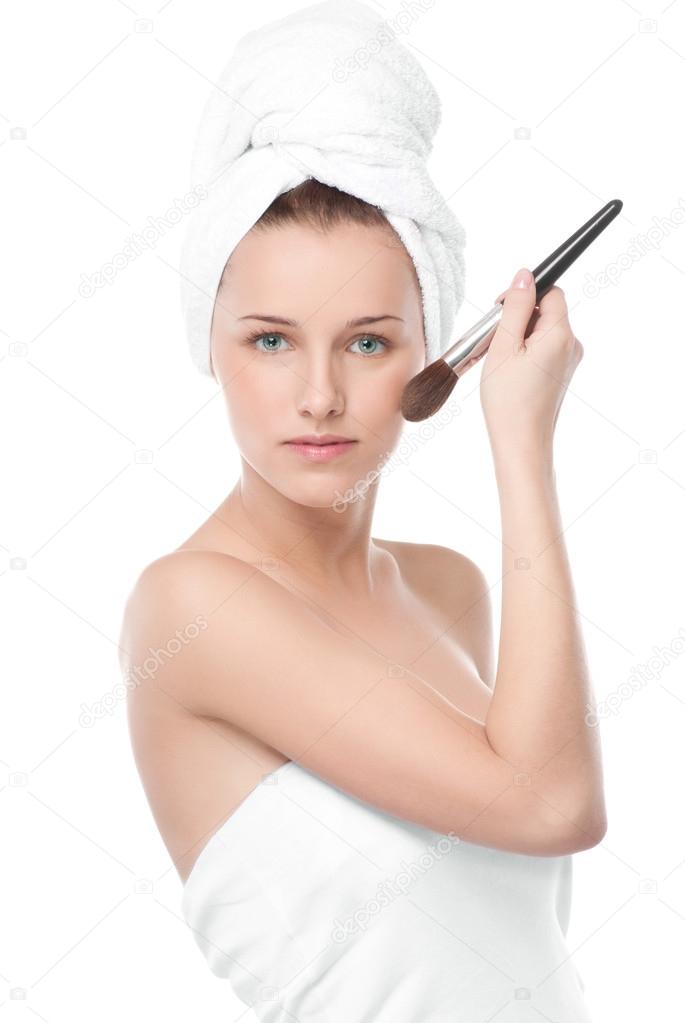 Beautiful woman with make up brush