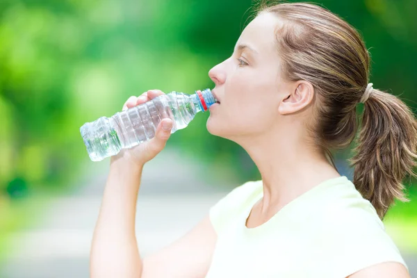 Woman drinking  water after fitness — Stock Photo, Image