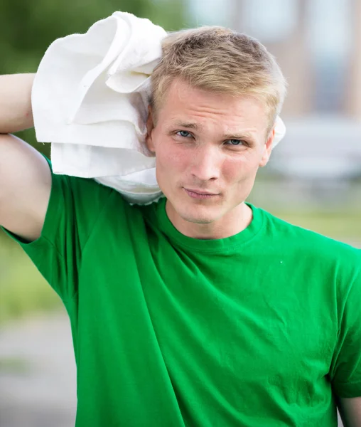 Tired man after fitness time and exercising. With white towel — Stock Photo, Image