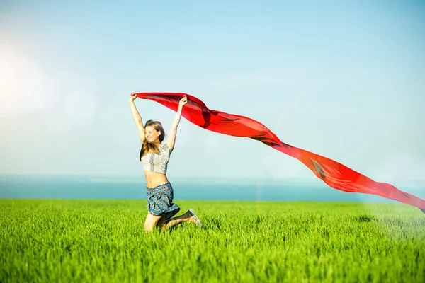 Young happy woman in wheat field with fabric. Summer lifestyle — Stock Photo, Image