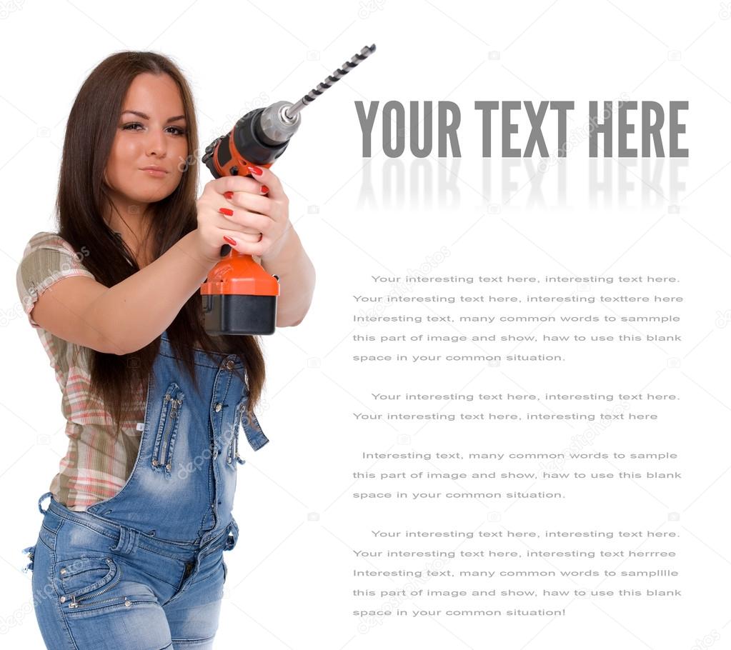 Young woman holding a cordless electric drill. Isolated on white
