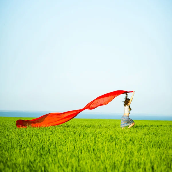 Young happy woman in wheat field with fabric. Summer lifestyle — Stock Photo, Image