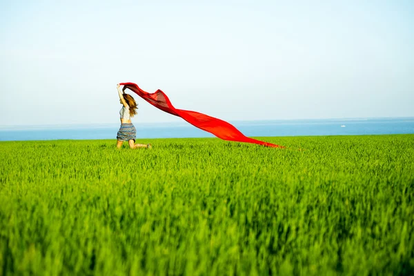 Young happy woman in wheat field with fabric. Summer lifestyle — Stock Photo, Image