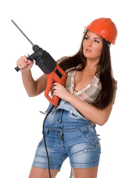 Young woman in jeans witch electric hammer drill.Isolated. — Stock Photo, Image