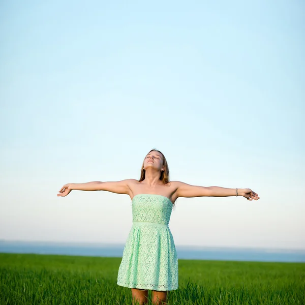 Happiness woman stay outdoor under sunlight of sunset Stock Photo