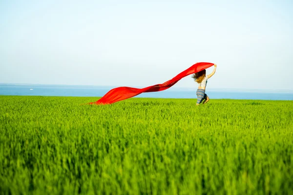 Young happy woman in wheat field with fabric. Summer lifestyle — Stock Photo, Image