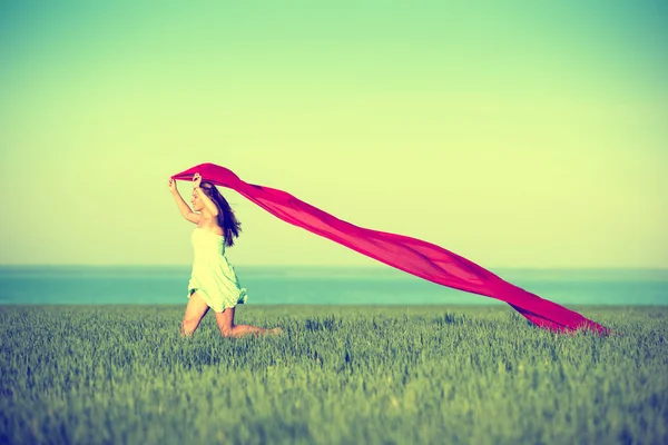 Young happy woman in wheat field with fabric. Summer lifestyle — Stock Photo, Image