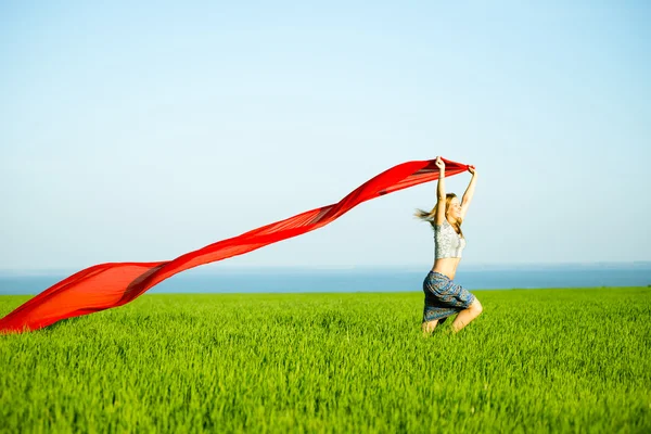 Young happy woman in wheat field with fabric. Summer lifestyle — Stock Photo, Image