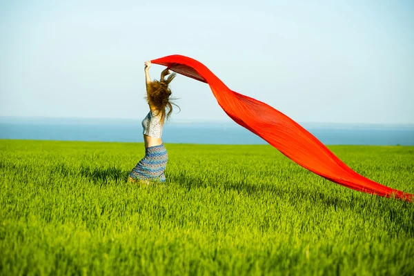 Young happy woman in wheat field with fabric. Summer lifestyle — Stock Photo, Image