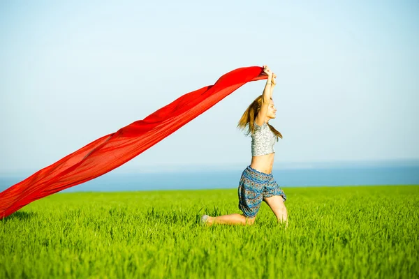 Young happy woman in wheat field with fabric. Summer lifestyle — Stock Photo, Image