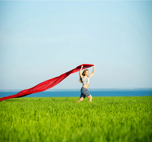 Young happy woman in wheat field with fabric. Summer lifestyle — Stock Photo, Image