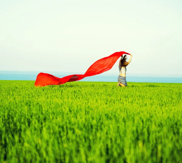 Young happy woman in wheat field with fabric. Summer lifestyle — Stock Photo, Image