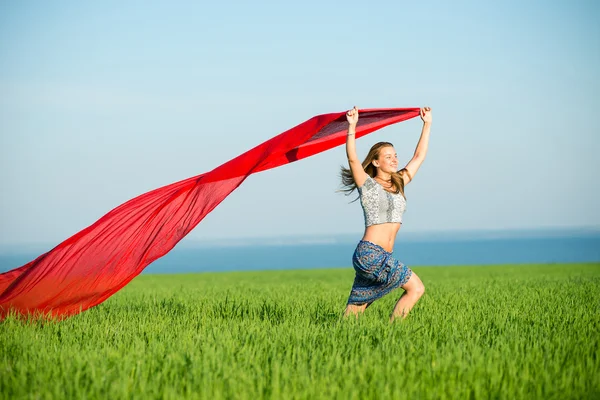 Young happy woman in wheat field with fabric. Summer lifestyle — Stock Photo, Image