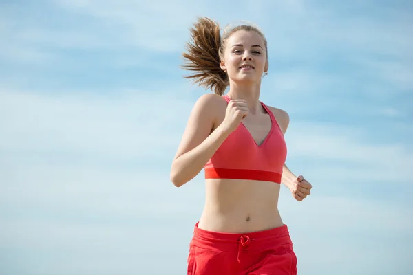 Young lady running at the sunny summer sand beach. Workout.  Jog — Stock Photo, Image