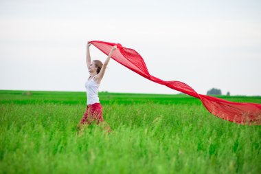 Genç Bayan runing doku yeşil alanı ile. Kadın eşarp ile.