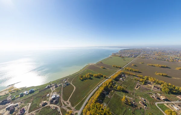 Aerial view of a summer house village at blue sea coast. — Stock Photo, Image