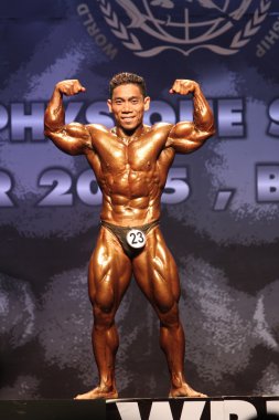 Pham Van Mach of Vietnam in action during World Bodybuilding and Physique Sport Championships 2015