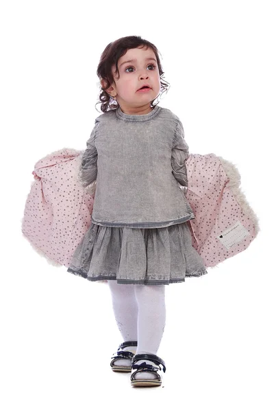 Porträtt av liten flicka i grå kläder — Stockfoto