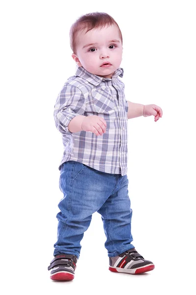 Portrait of small boy in blue trousers — Stock Photo, Image