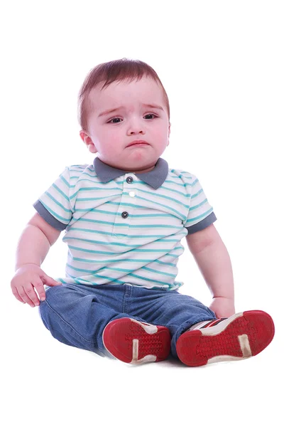 Retrato de menino pequeno em calças azuis — Fotografia de Stock