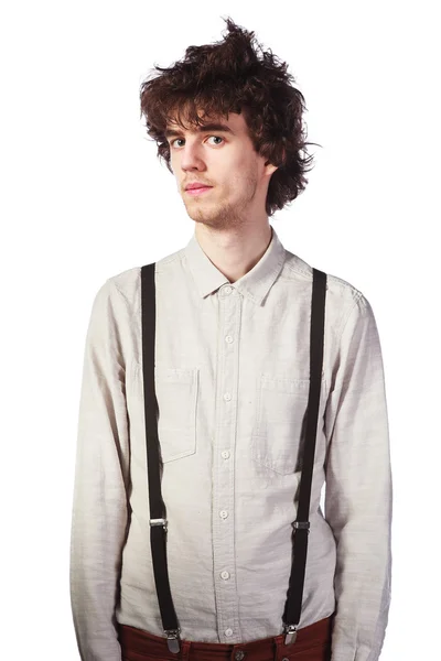 Portret van een knappe man in een wit overhemd met bretels over — Stockfoto