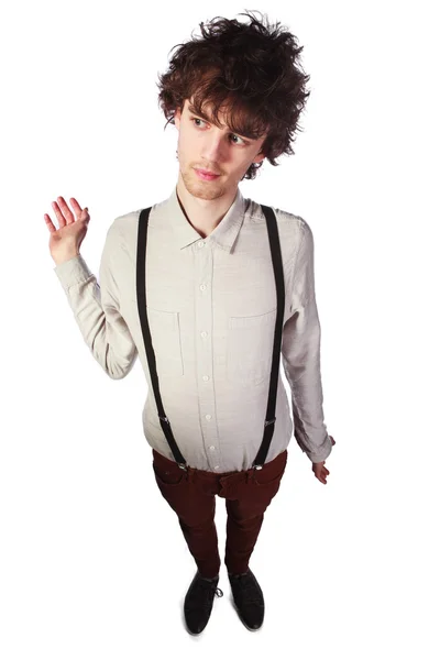 Portrait of a handsome guy in a white shirt with suspenders over — Stock Photo, Image