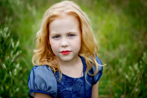 Portrait of beautiful little girl in the blue dress — Stock Photo, Image