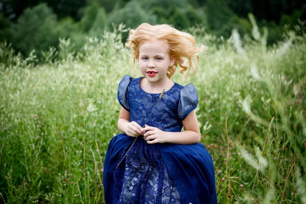 Portrait of beautiful little girl in the blue dress — Stock Photo, Image