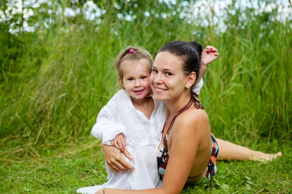 Mom and daughter are bathing in river — Stock Photo, Image