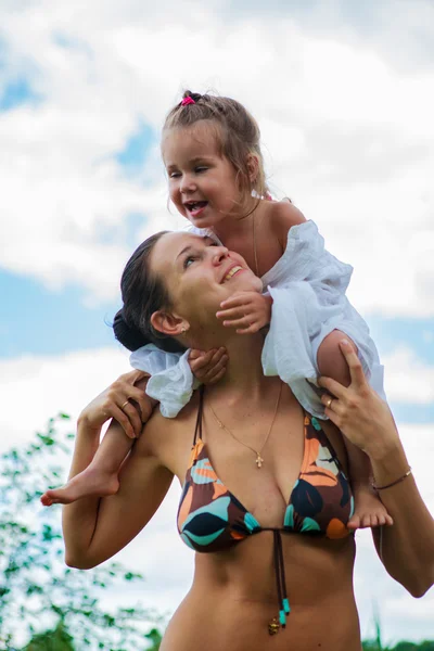 Mom and daughter are bathing in river — Stock Photo, Image