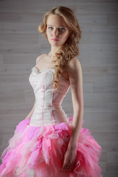 Portrait of a beautiful girl in a pink dress — Stock Photo, Image