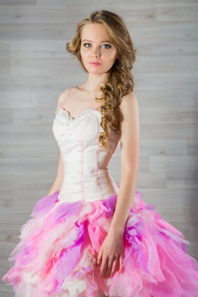 Portrait of a beautiful girl in a pink dress — Stock Photo, Image