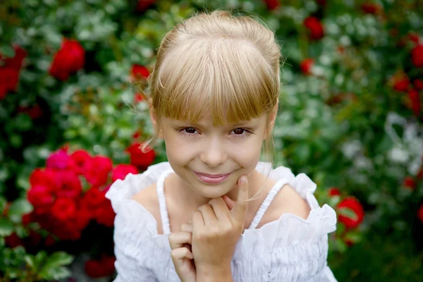 Portrait of beautiful little girl in white blouse — Stock Photo, Image