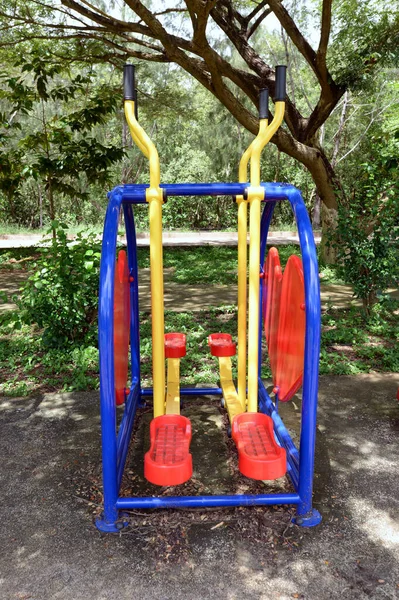 Colorful Outdoor Exercise Machines Park Lush Many Green Trees — Stock Photo, Image