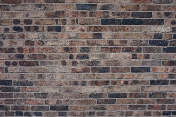 Brązowy Czarny Cegły Solidny Mur Budynku — Zdjęcie stockowe