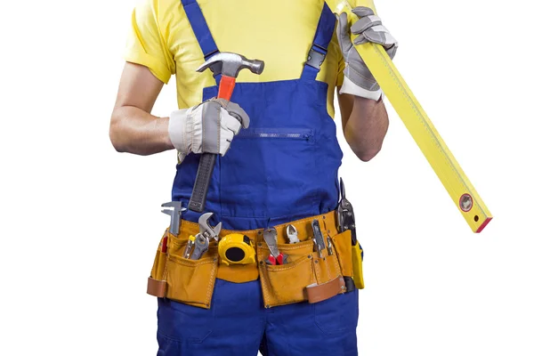 Trabajador de la construcción con correa y herramientas en las manos en blanco — Foto de Stock