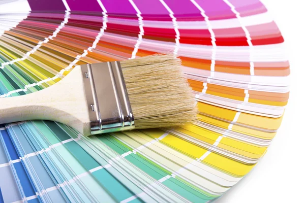 Paintbrush on a palette color guide Royalty Free Stock Photos