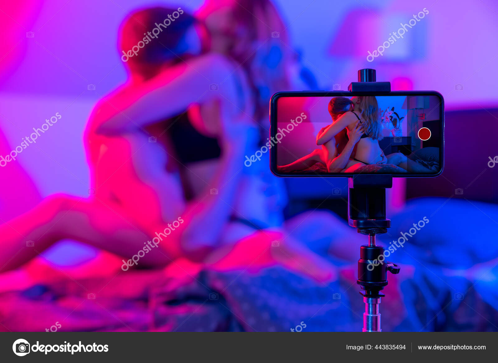 Young Couple Bed Recording Sex Video Mobile Phone Camera Neon Stock Photo  by ©ronstik 443835494