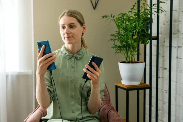 Woman Transfer Data Old New Phone Cable Connection — Stockfoto