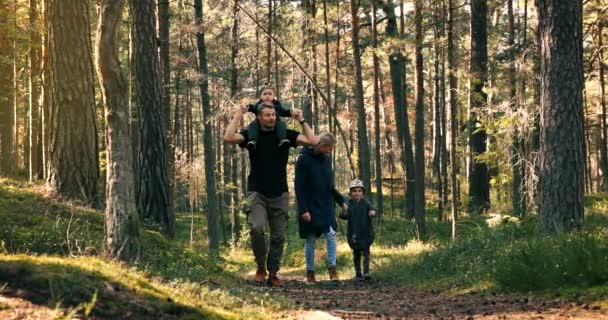 Active Young Family Walks Forest Trail Children Son Sitting Dad — Stock Video