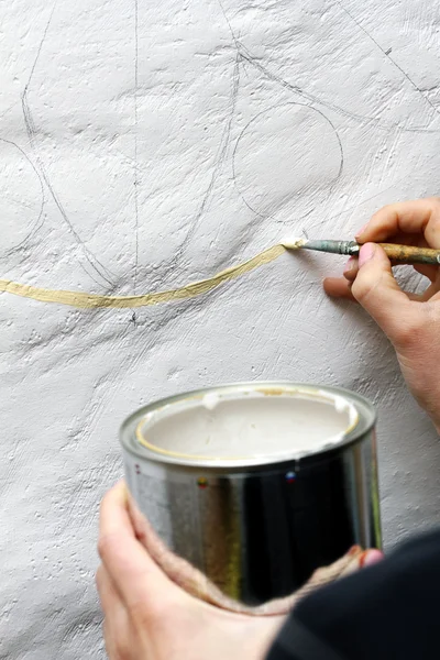 Artist paints oil painting on the wall — Stock Photo, Image