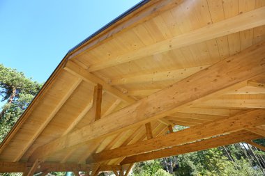 wooden roof construction of outdoor carport clipart