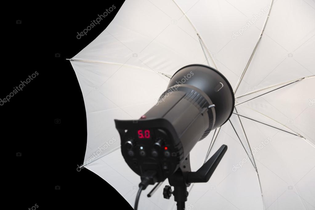 photography studio strobe flash with white umbrella and black co