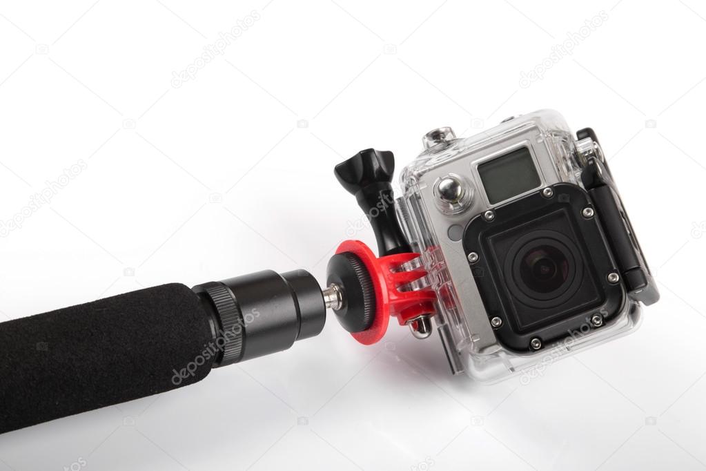 action camera with handheld stick isolated on white