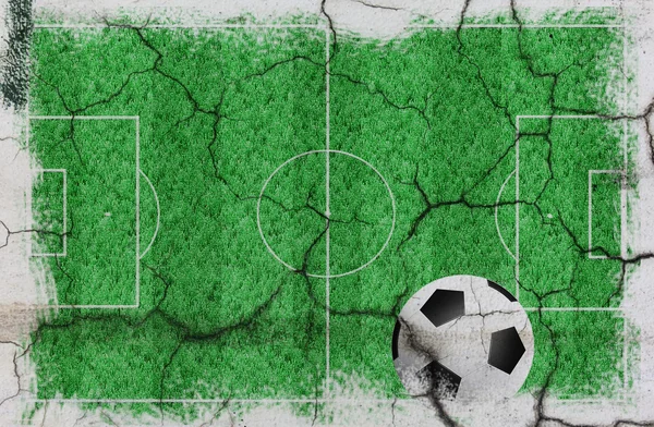 Текстура футбольного поля с мячом — стоковое фото