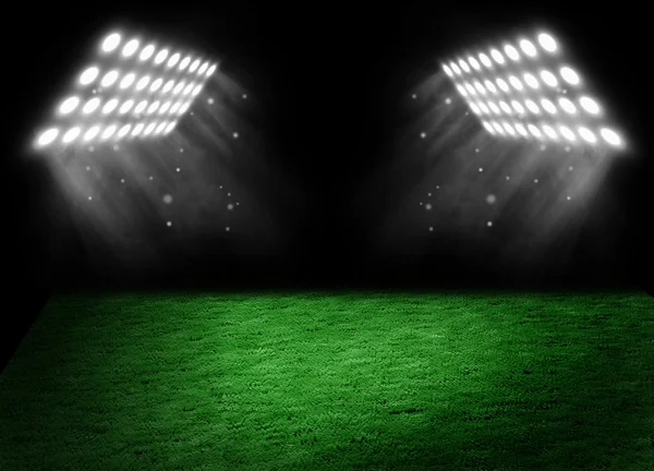 Football on the stadium lawn with light of searchlights — Stock Photo, Image