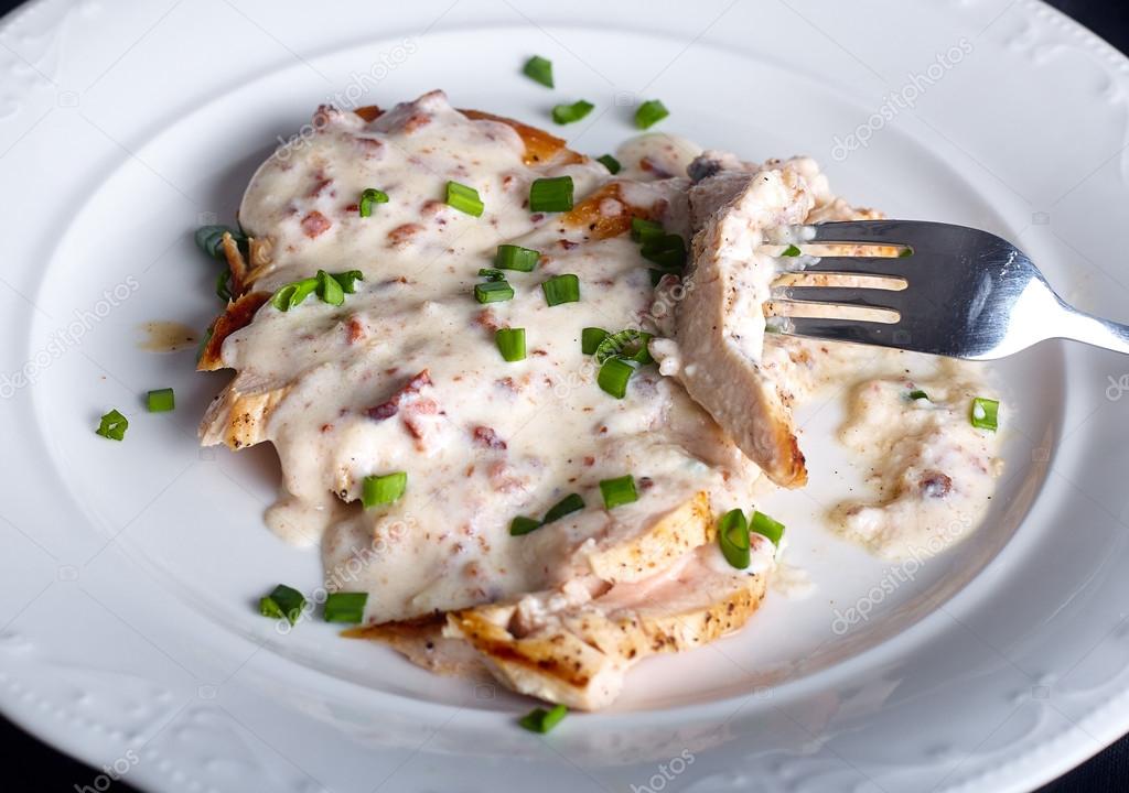 Grilled chicken breast with cheese sauce