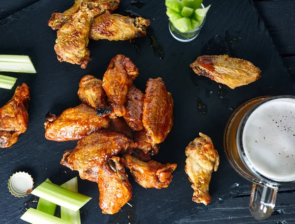 Plate of crispy delicious buffalo chicken wings — Stock Photo, Image